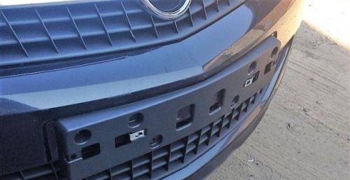 Накладка бампера CHEVROLET/OPEL OE (Панель номерного знака)