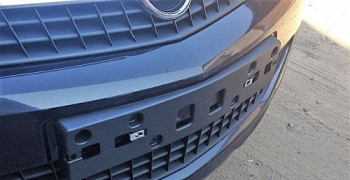 Накладка бампера CHEVROLET/OPEL OE (Панель номерного знака)